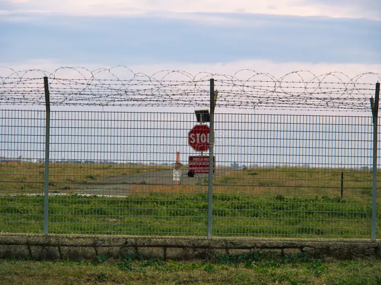 airport-security-perimeter-fencing-system-razor-wire-sra-security-restricted-area-stop-sign-airplanes-behind-airport-272117251 airport-security-perimeter-fencing-system-razor-wire-sra-security-restricted-area-stop-sign-airplanes-behind-airport-272117251