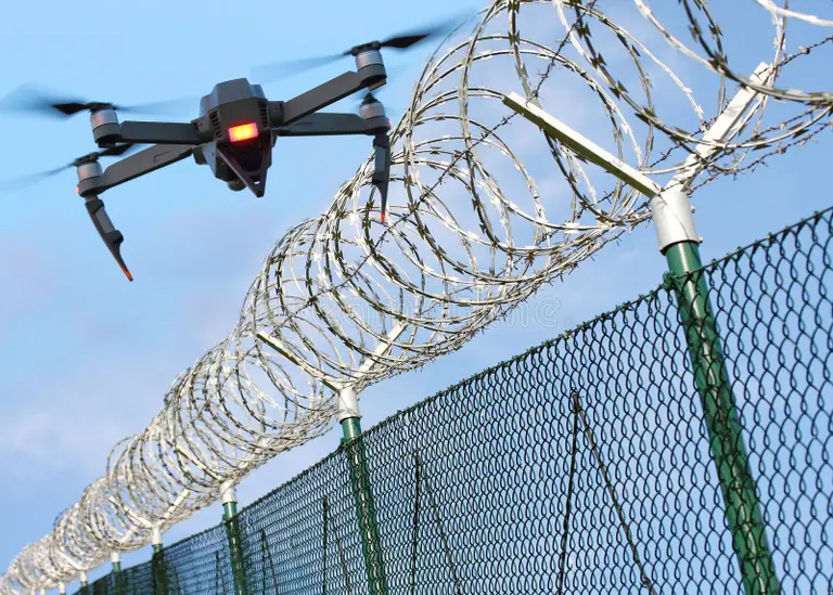 drone-security-state-border-restricted-area-monitoring-barbed-wire-fence-modern-technology-107450663 drone-security-state-border-restricted-area-monitoring-barbed-wire-fence-modern-technology-107450663